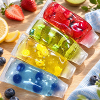 Les 4 squishys tubes fruités : fraise, vert, citron et myrtille